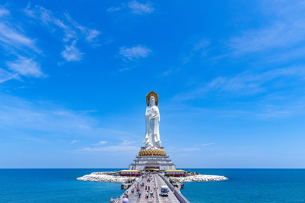 Nanshan Cultural Tourism Zone brings you face to face with the towering Nanhai Guanyin—a 108-meter-tall statue of the Buddhist goddess of mercy